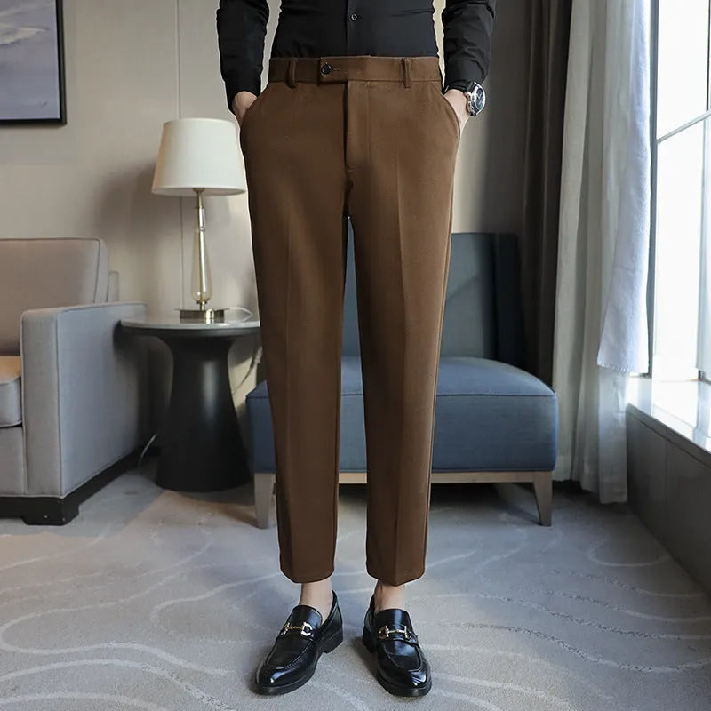 Straight-leg brown corduroy trousers with elastic waistband on size chart