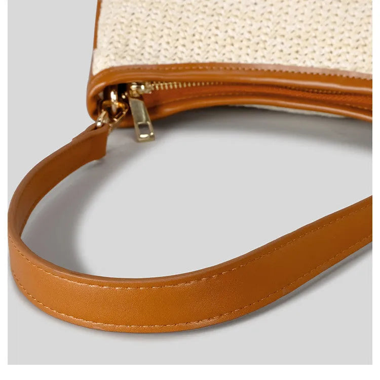 Khaki hand-woven straw crossbody bag made from PP grass with a single shoulder strap.