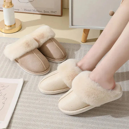 Women's plush winter slippers with round toe, flat heel, and stitching detail on a non-slip PVC sole.