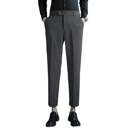 Straight-leg brown corduroy trousers with elastic waistband on size chart