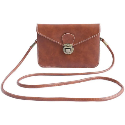 Retro shoulder messenger bag in cross square shape with flap and lock closure, showing internal mobile phone compartment