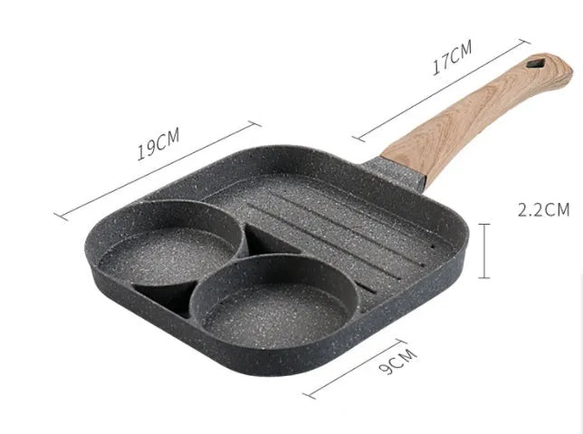Four-hole aluminium frying pan with medical stone non-stick coating and bakelite handle on a hob
