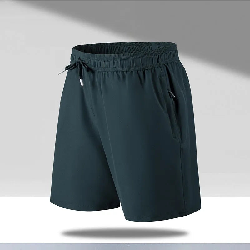Man wearing black loose-fit quick-dry polyester sports shorts on a summer day.