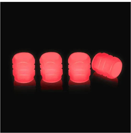 Glow-in-the-dark rubber tyre valve caps in five colour options on tyre valve stem