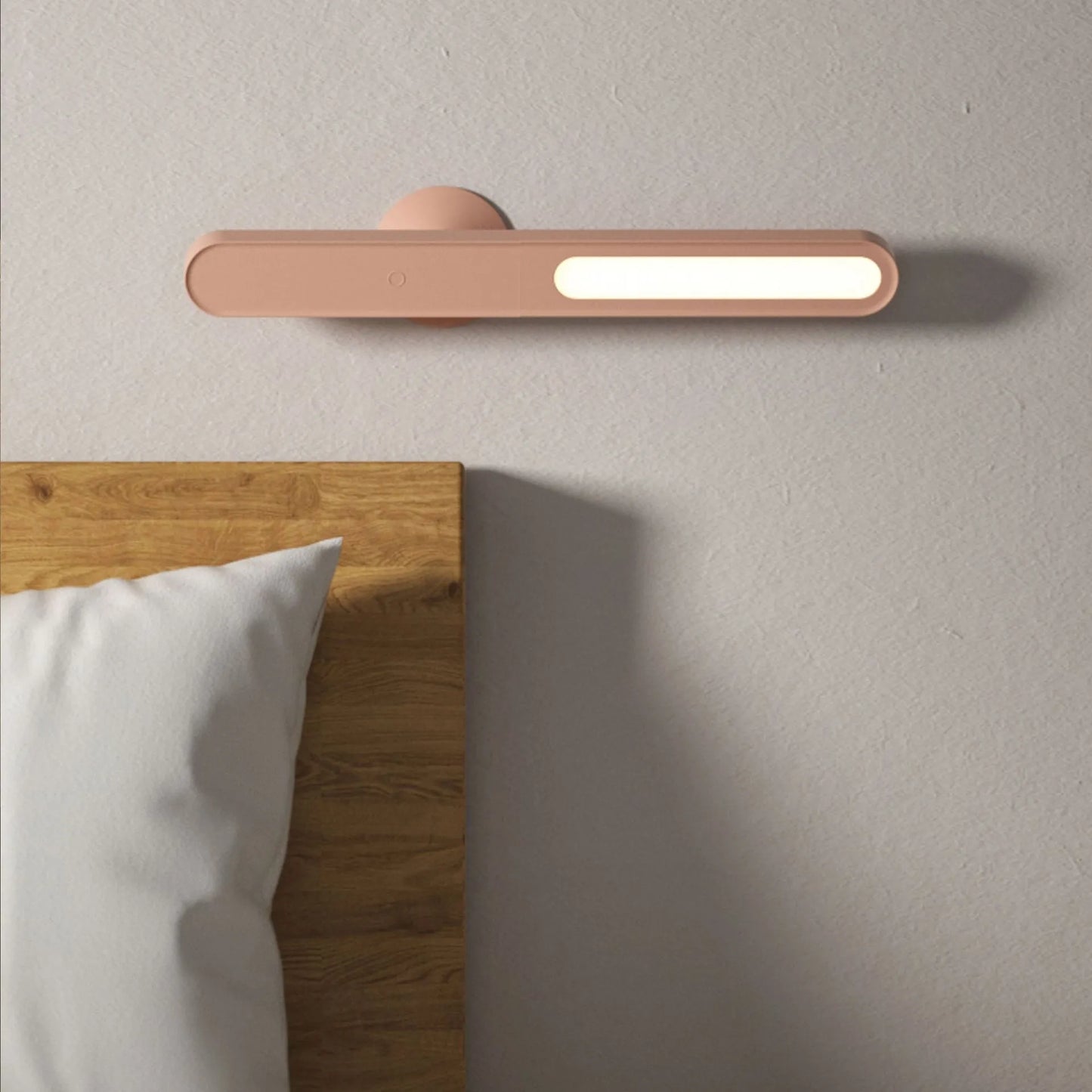 White geometric desk lamp with magnetic base and touch control on a wooden table.