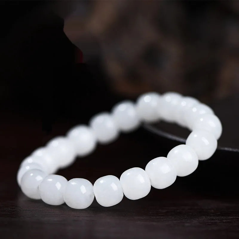 White jade barrel beads bracelet with Hetian jade beads in 5x6mm, 7x8mm, or 8x10mm sizes on a wrist