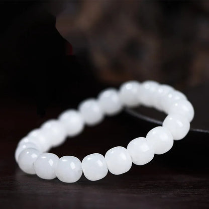 White jade barrel beads bracelet with Hetian jade beads in 5x6mm, 7x8mm, or 8x10mm sizes on a wrist