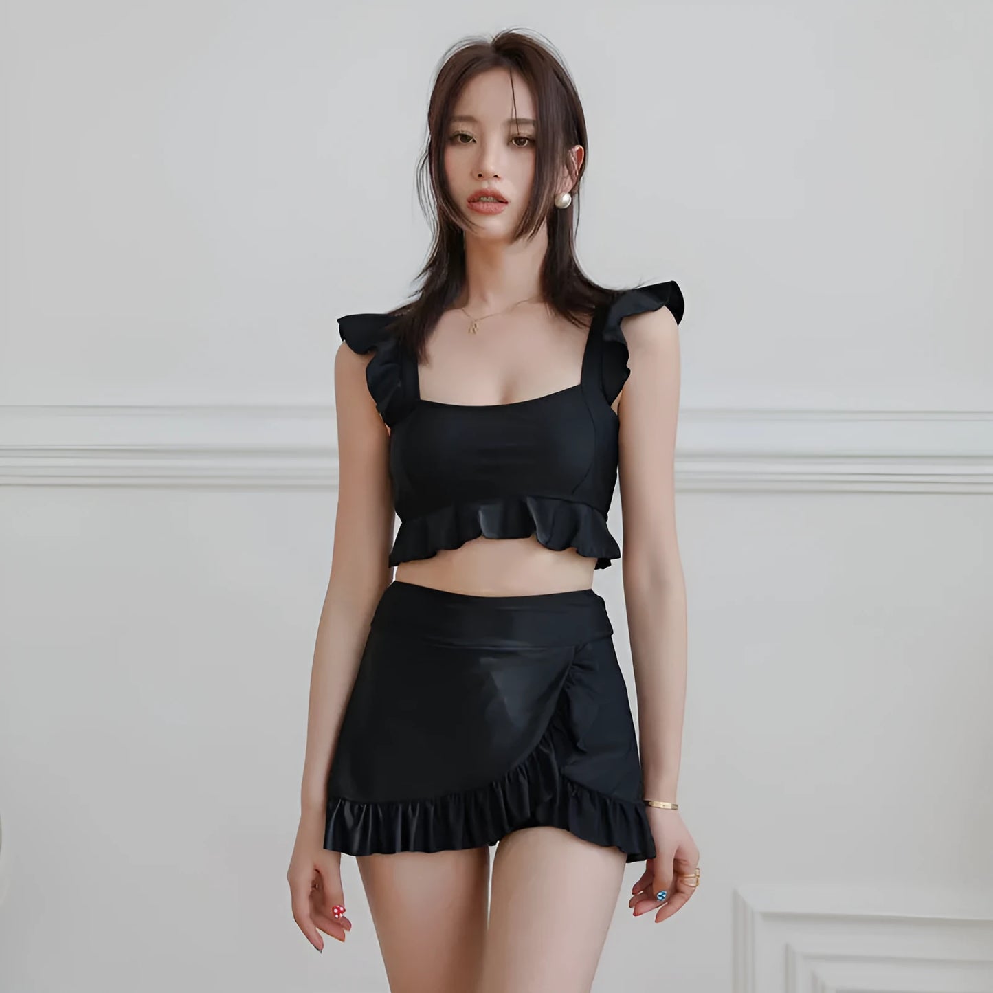 Black women's split bikini swimsuit in briefs style on a mannequin