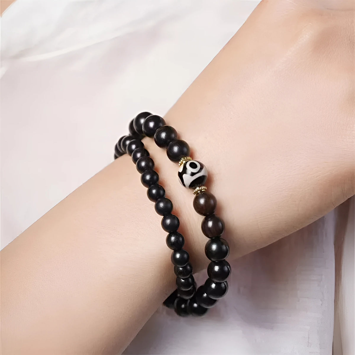 Tibet beads ebony bracelet showing two wooden circles on dark wood with 8mm diameter