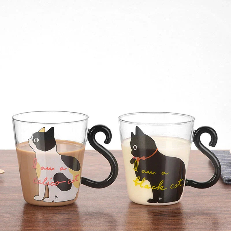 Adorable cat-themed glass mug with a whimsical cat-shaped handle, perfect for coffee, tea, and juice lovers