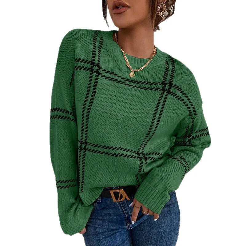 Women's loose-fitting plaid crew neck sweater with apricot, black, beige, red, and green colour-block stripes.