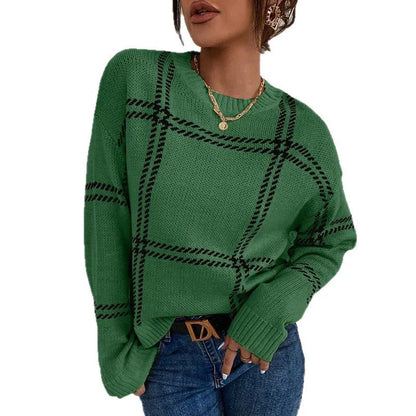 Women's loose-fitting plaid crew neck sweater with apricot, black, beige, red, and green colour-block stripes.