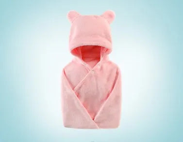 Blue hooded baby bath towel with dimensions 65cm by 110cm laid flat.