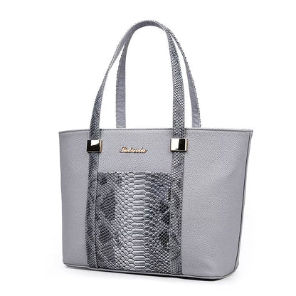Women's shoulder bag with zipper closure and multiple pockets in light grey, black, off-white, and rose red