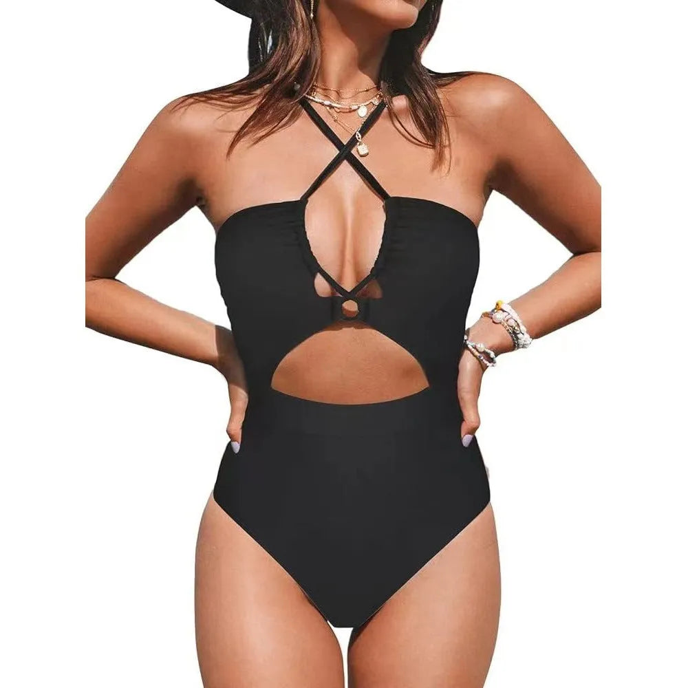 Women's black cross-back one-piece swimsuit with backless design on mannequin