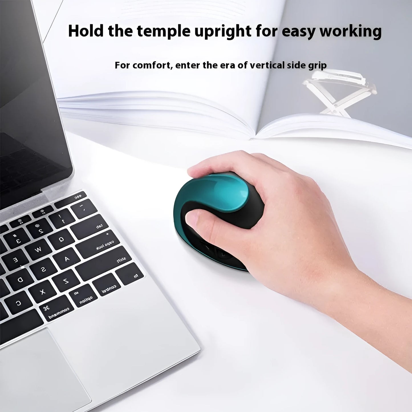 Ergonomic vertical mouse in black, shown next to a laptop, highlighting its unique upright shape and USB receiver.