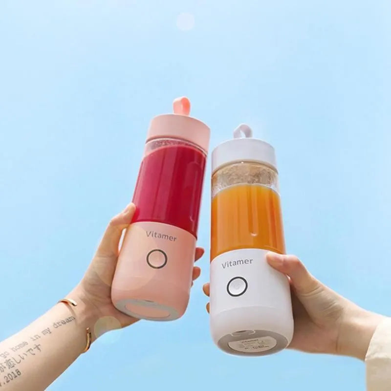 White portable USB rechargeable blender bottle with silicone handle on a Tritan cup.
