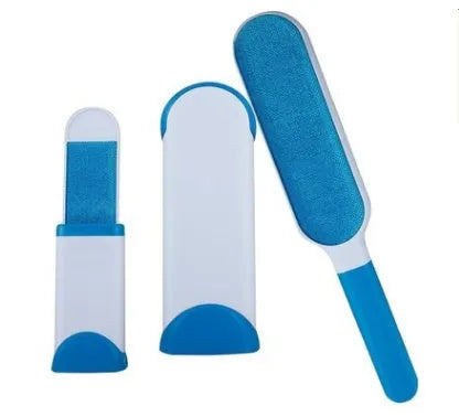 Blue reusable pet hair removal brush with double-sided head next to its self-cleaning base.