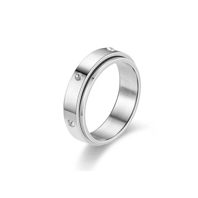 Rotatable stainless steel spinner ring with moon and star designs for anxiety relief and style