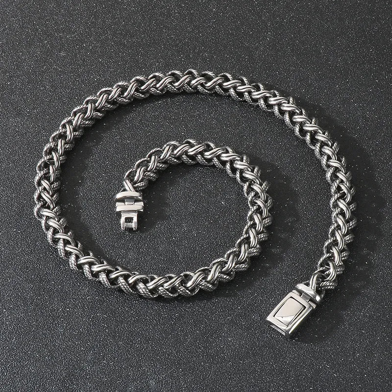 Men's antique silver titanium steel keel chain necklace with large geometric links on a black background.