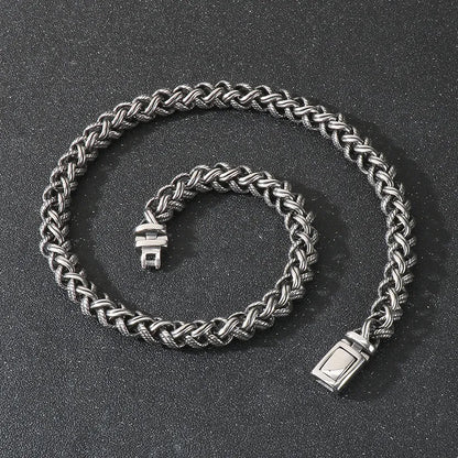 Men's antique silver titanium steel keel chain necklace with large geometric links on a black background.