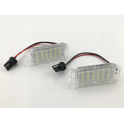 White 12V license plate lamp pair for Ford Focus Fiesta Mondeo with 6500K output and PC body
