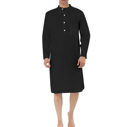 Man wearing a dark blue cotton shirt robe with button front, long sleeves, and side pockets.