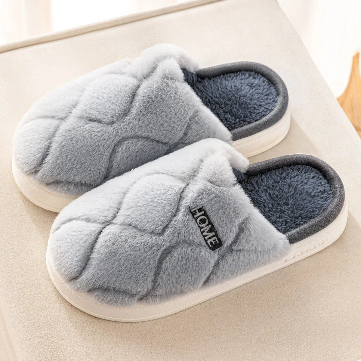 Cozy plush slippers with a soft, luxurious upper and durable PVC sole for comfortable indoor wear