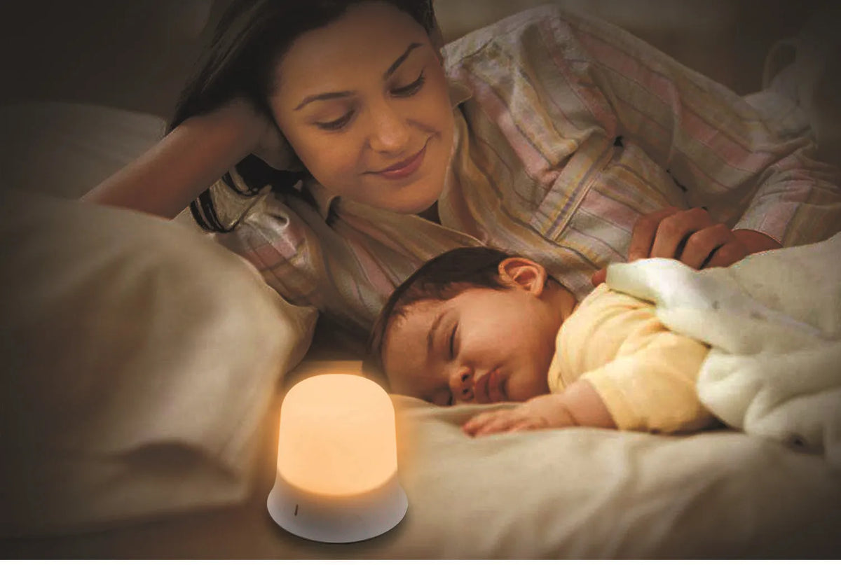 White rechargeable bedside night light with touch controls showing dimming and colour options