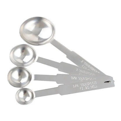 Set of six stainless steel measuring spoons connected by a silver D-ring, showing engraved measurement markings