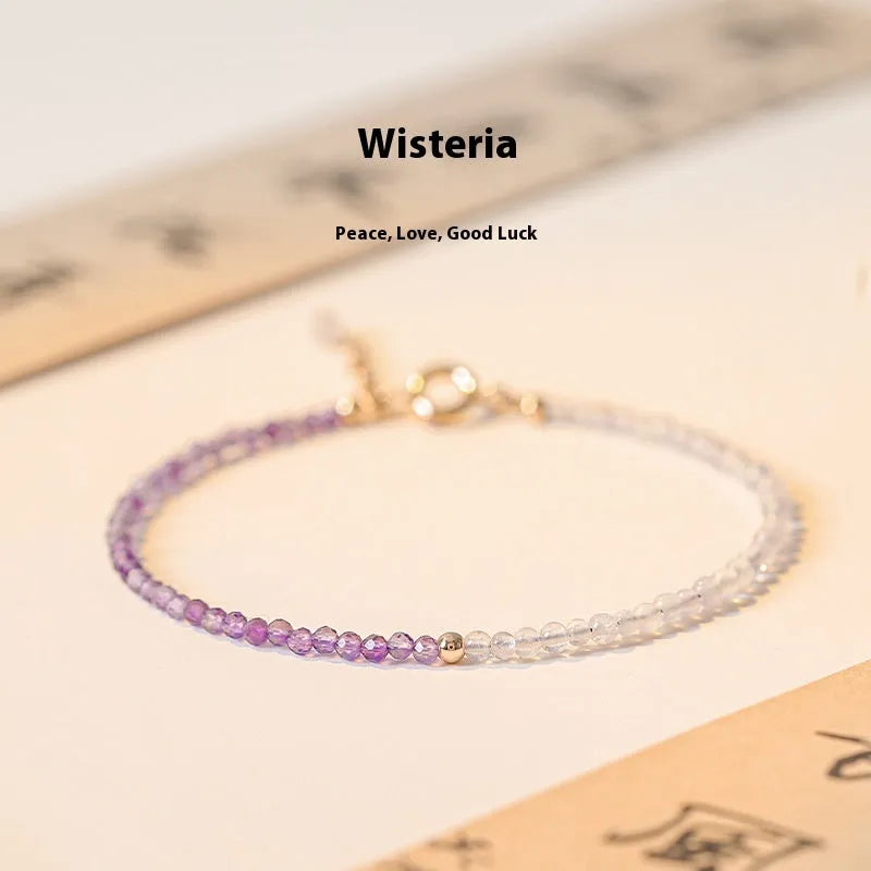 Women's geometric crystal bracelet with cut facets and spherical sections in 2mm purple rattan style.