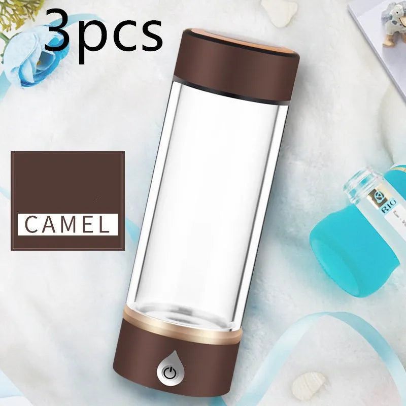Portable hydrogen water ionizer bottle with high borosilicate glass cup in silver finish.