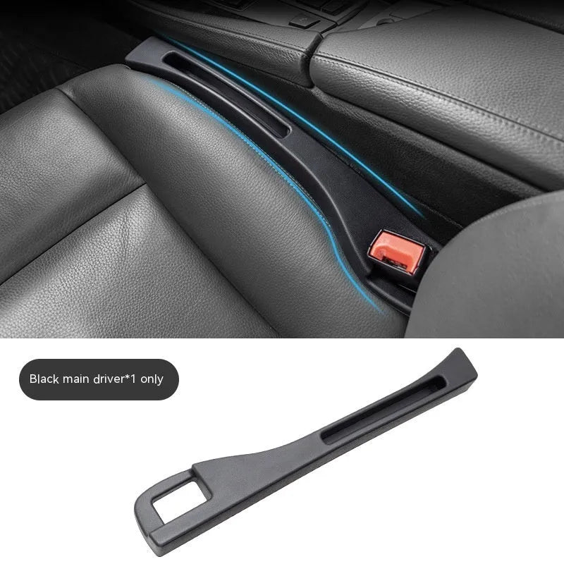 Black car seat gap storage box organiser with compartments and carrying handle between vehicle seats