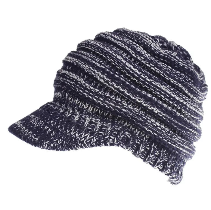 Women's acrylic knitted ponytail beanie in a solid colour, shown on a model with a ponytail.