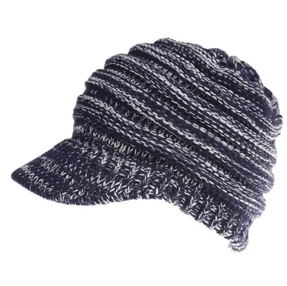 Women's acrylic knitted ponytail beanie in a solid colour, shown on a model with a ponytail.
