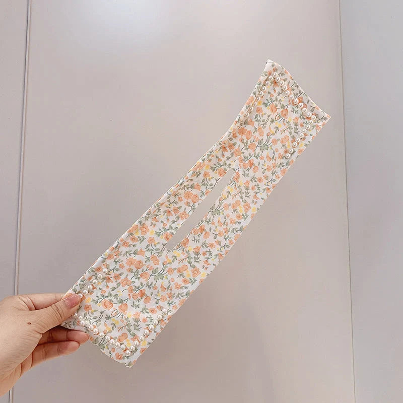 Women's elegant cloth headband with diamond or pearl accents for stylish hairstyles