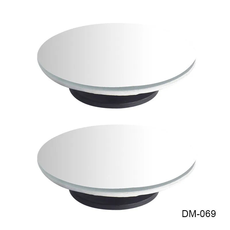 Glass adjustable blind spot rearview mirror with sponge adhesive backing for car installation.