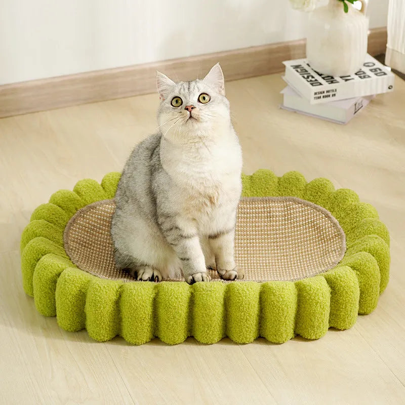Green oval-shaped sisal cat scratching pad with a deep centre bowl for use as a cat bed.