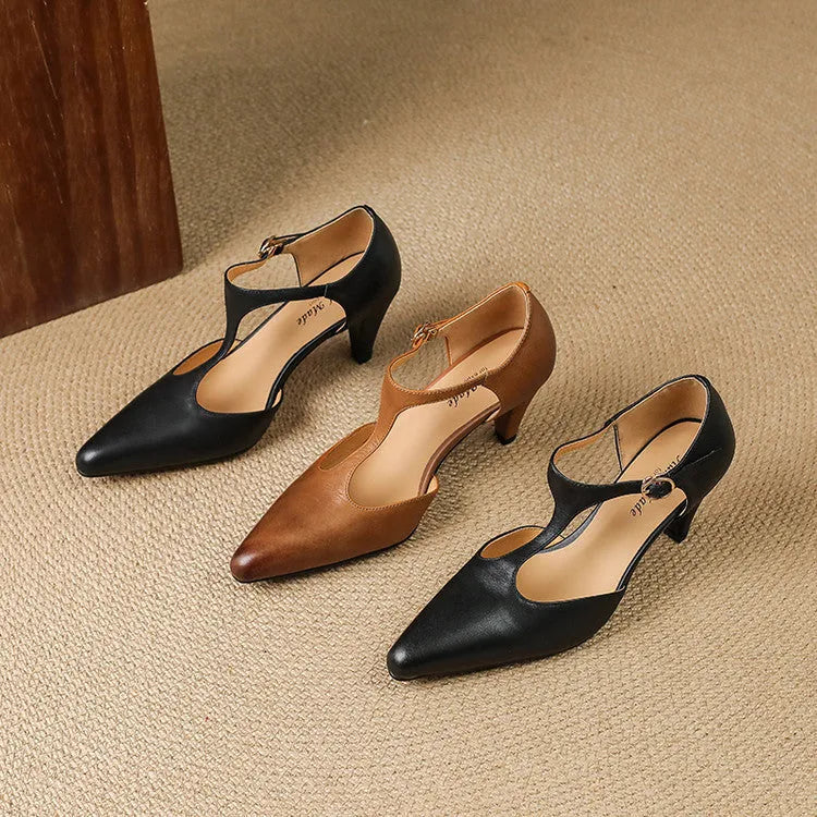 Brown retro women's T-strap sandals with a closed toe and a short stout block heel.