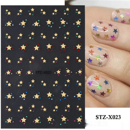 Assortment of black and silver nail sticker designs including cartoon and French tip patterns on a plastic sheet.