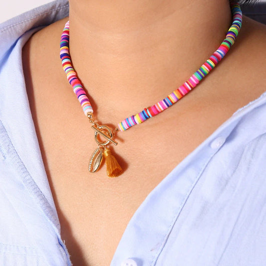 Bohemian shell tassel necklace for women featuring a unique shell charm and soft ceramic alloy tassel.