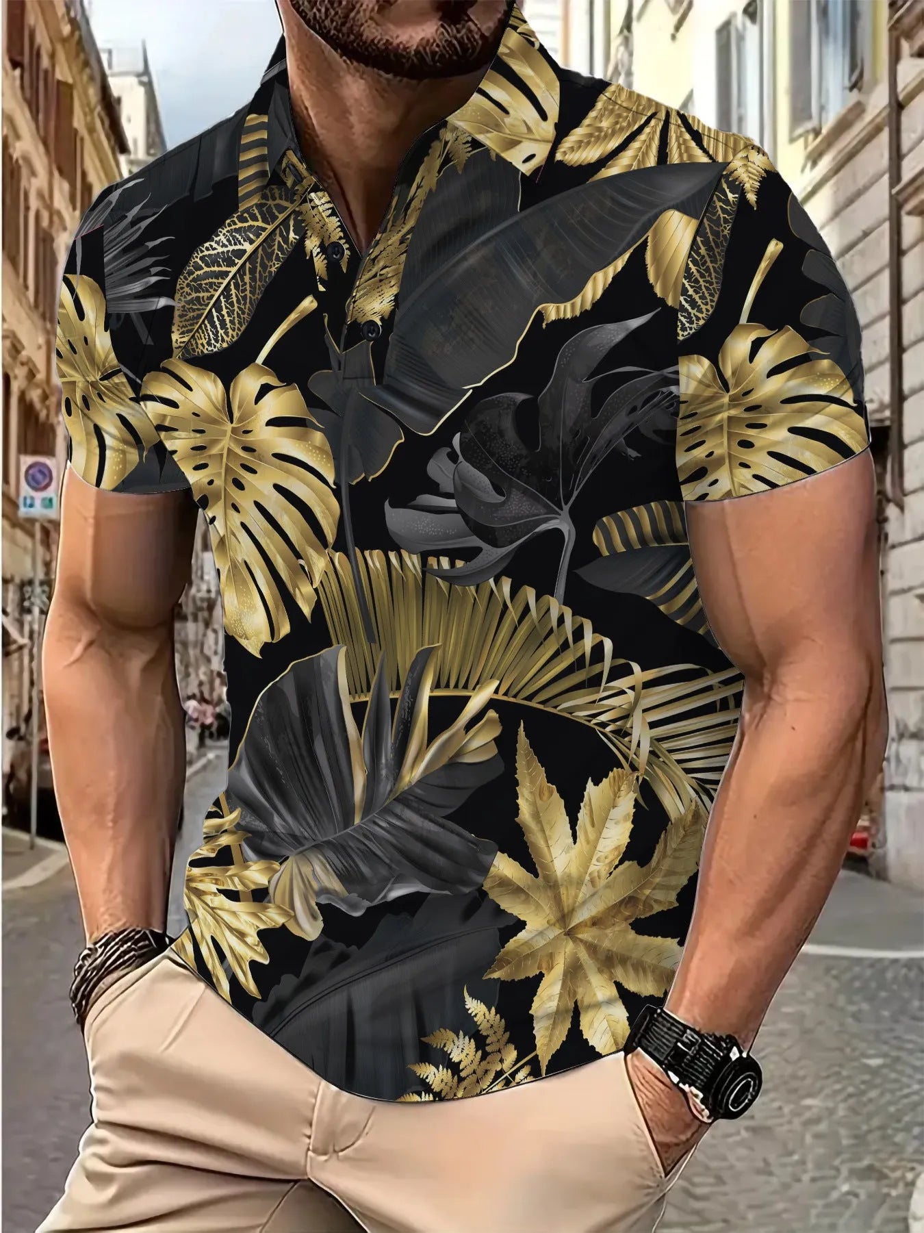 Men's gold tropical plant pattern short sleeve shirt laid flat showing print detail