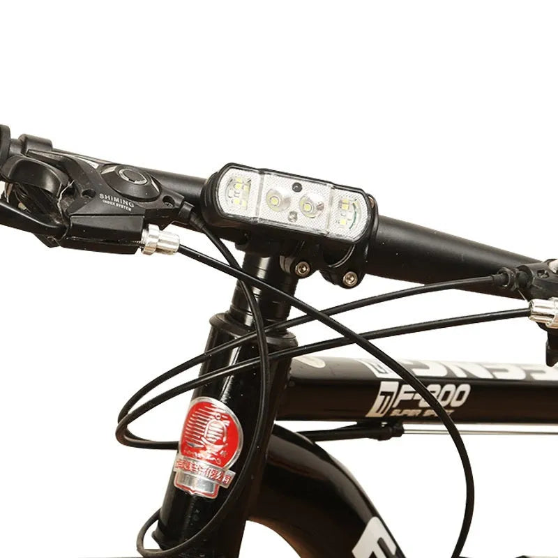 Black USB rechargeable bicycle headlight with 350 lumen output mounted on handlebars