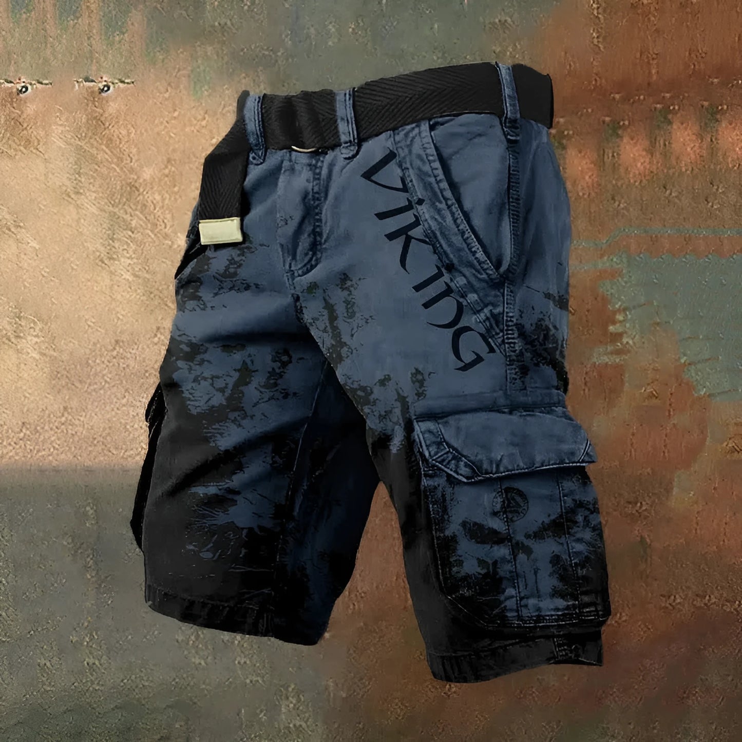 Man wearing grey 3D digitally printed polyester shorts with a zip fastening.