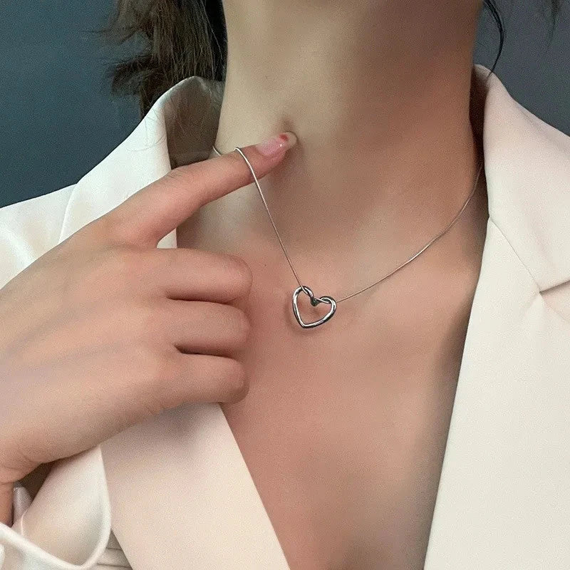 Elegant titanium steel heart pendant necklace with adjustable chain in gold and silver colors