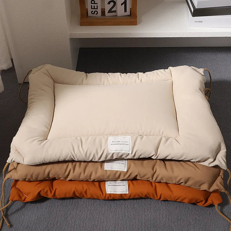 Beige cage cushion for dogs tied inside a metal crate, shown next to coffee and orange colour options.