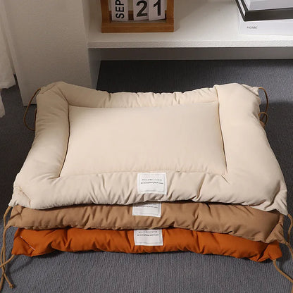 Beige cage cushion for dogs tied inside a metal crate, shown next to coffee and orange colour options.
