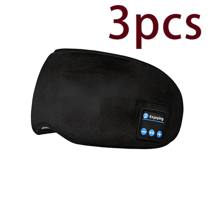 Black Bluetooth eye mask with memory foam padding and adjustable headband for light blocking and audio