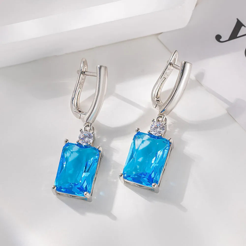 Square geometric earrings with gold electroplated finish on copper base