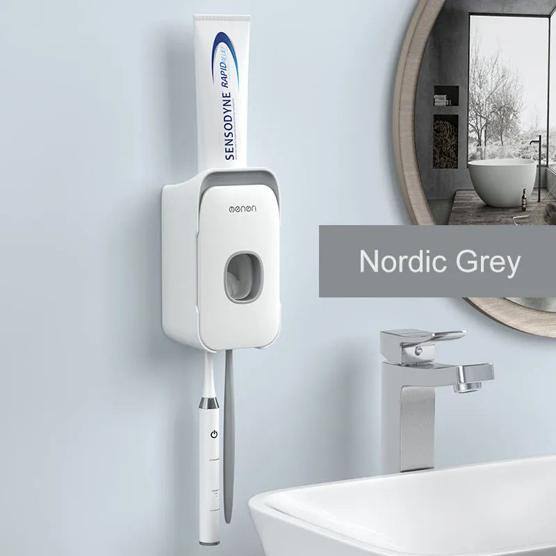 Automatic wall-mounted toothpaste dispenser in blue, grey, and pink colours with LED touch sensor.